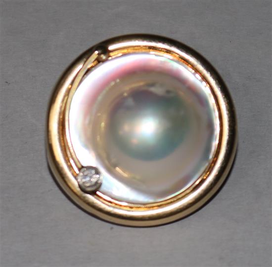 A 14ct gold, mabe pearl and diamond set circular clip, 1in.